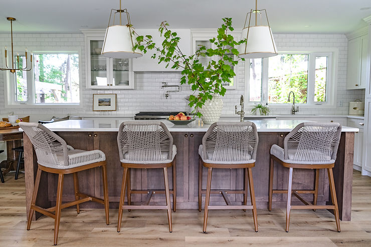 transitional cream kitchen with plaster hood fan stained island