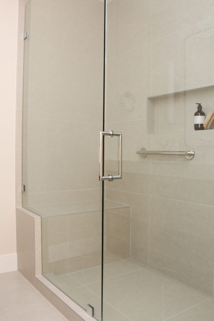 Custom tile shower with linear niche and bench
