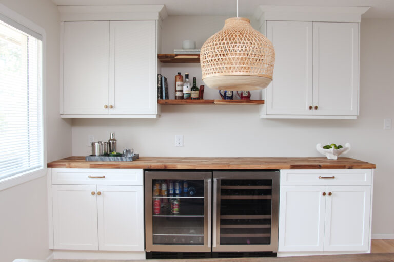 bar in dining room, white cabinets, butcher block countertop, floating wood shelves