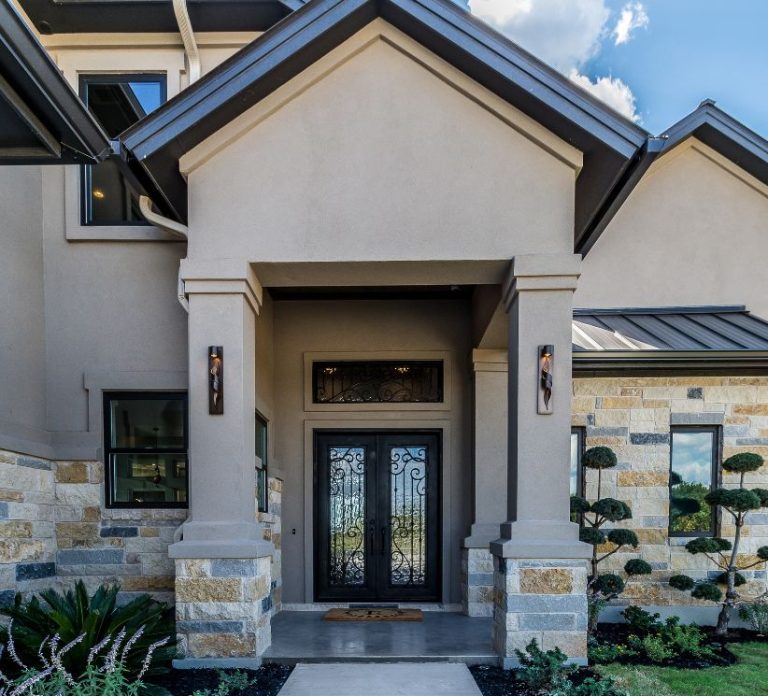 House with unnecessary stone at waterline