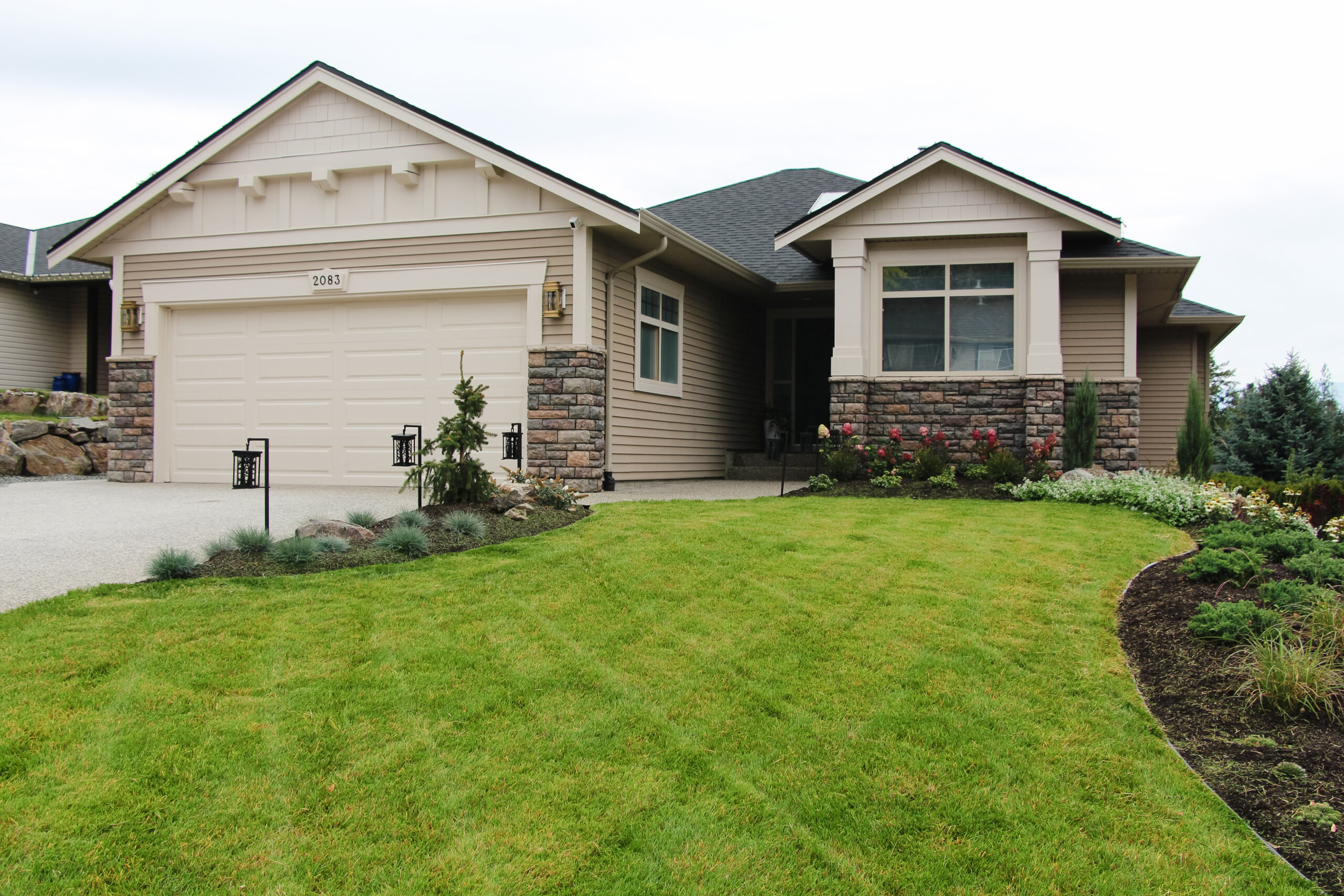 exterior update landscaping and fresh paint on a 2000s home
