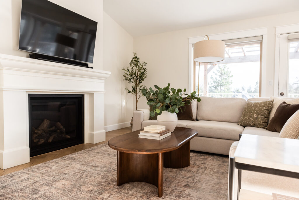 transitional living room cast stone fireplace, floor mirror