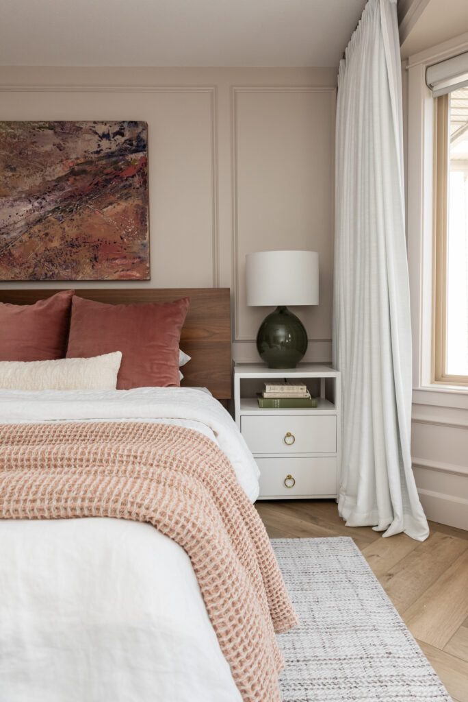 blush bedroom with abstract art pink green purple