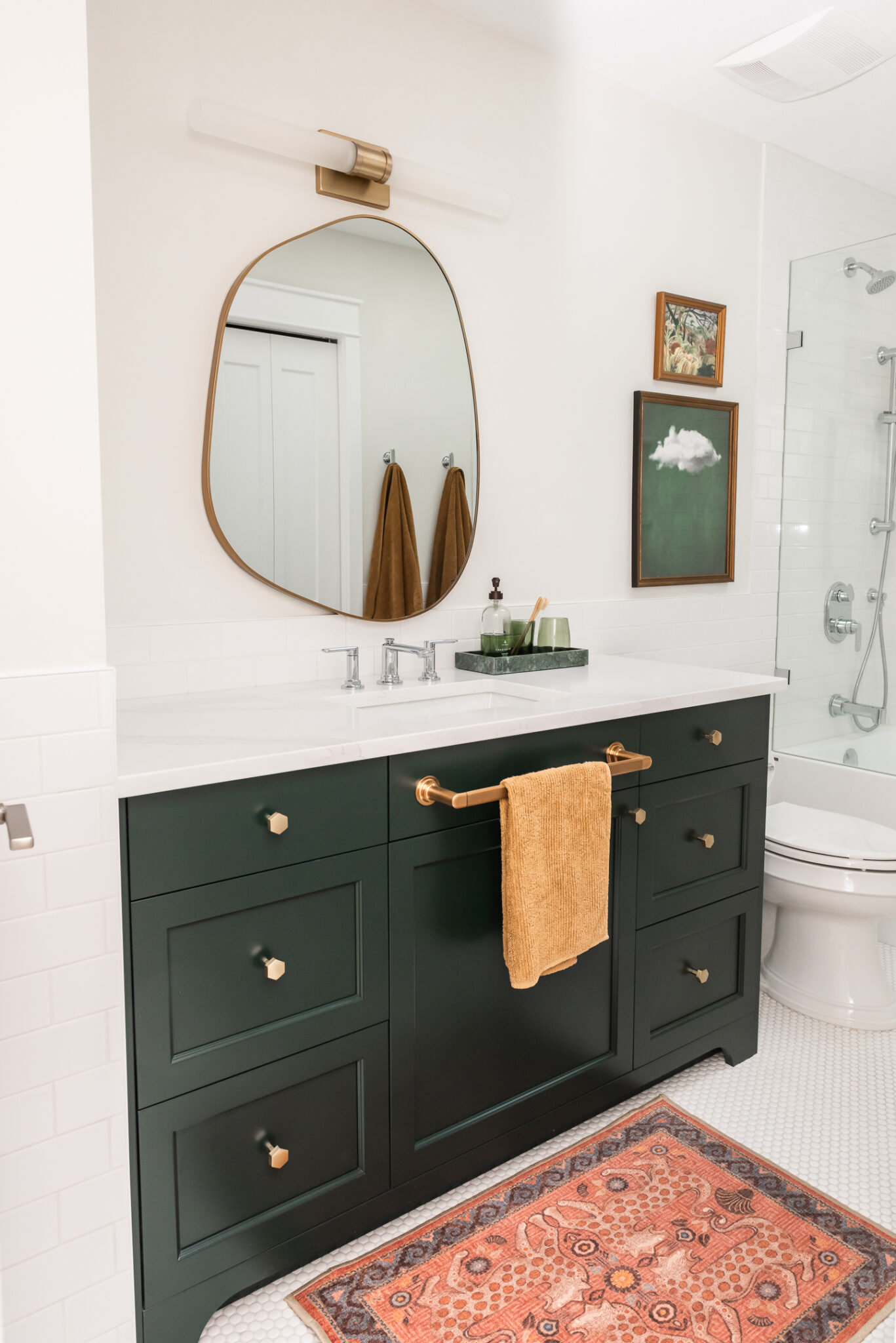 kids bath, boys bathroom, green vanity, irregular mirror, subway tile halfwall
