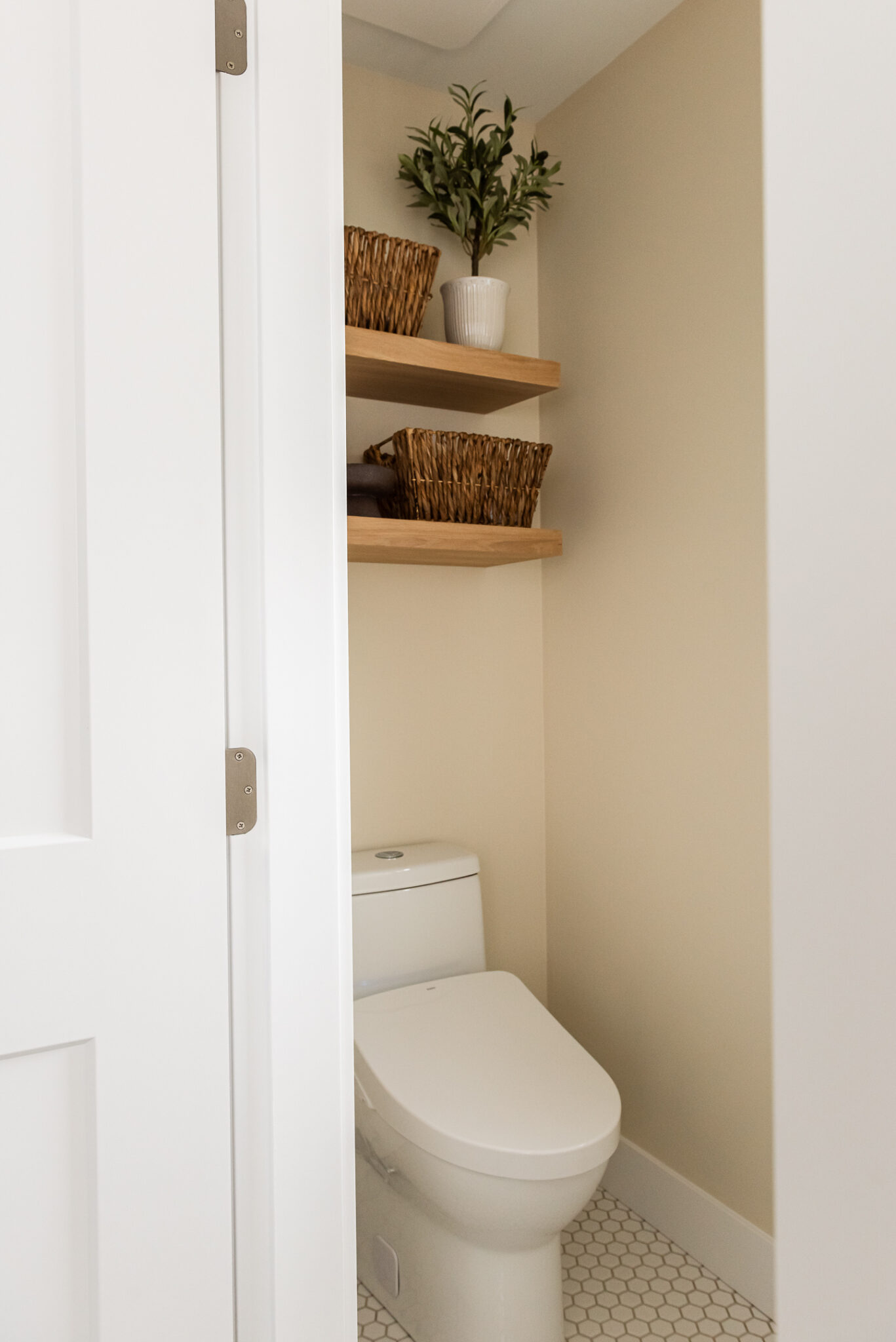 water closet with bidet and shelves