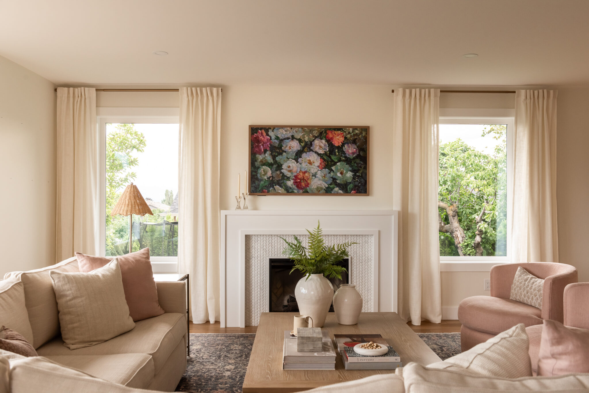 pink living room, swivel chairs, fireplace
