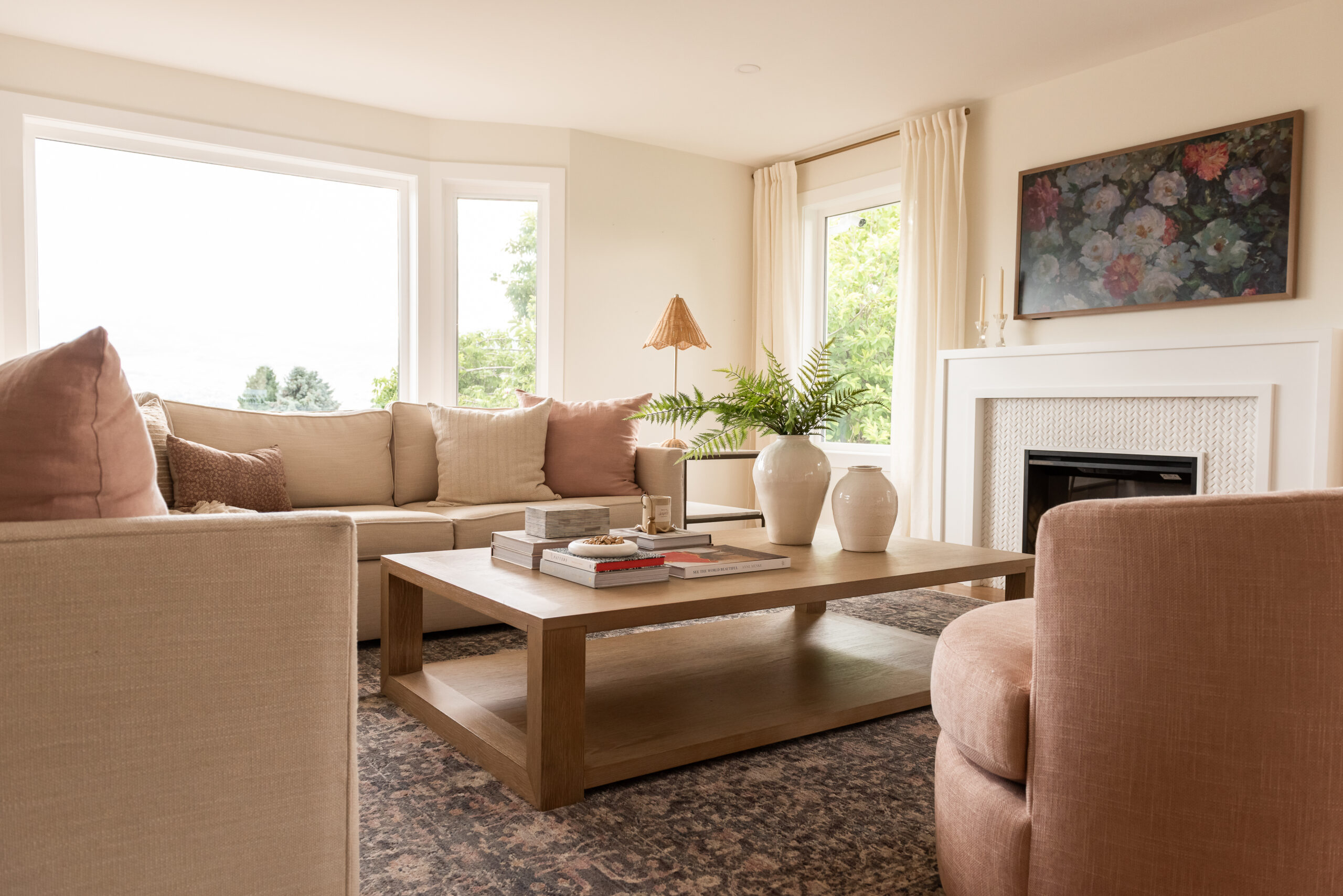 pink living room, swivel chairs, fireplace