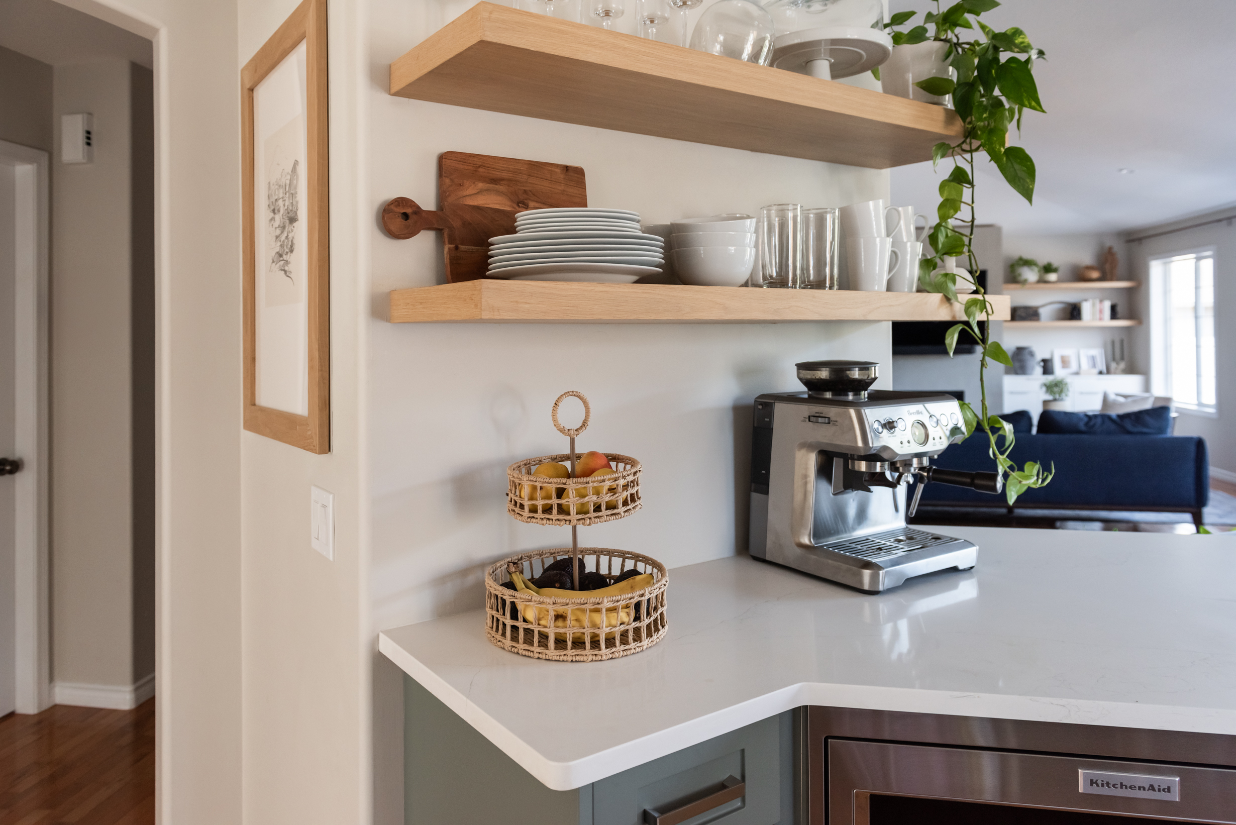 Thoughtfully styled kitchen shelves that soften the space while maintaining function and flow.