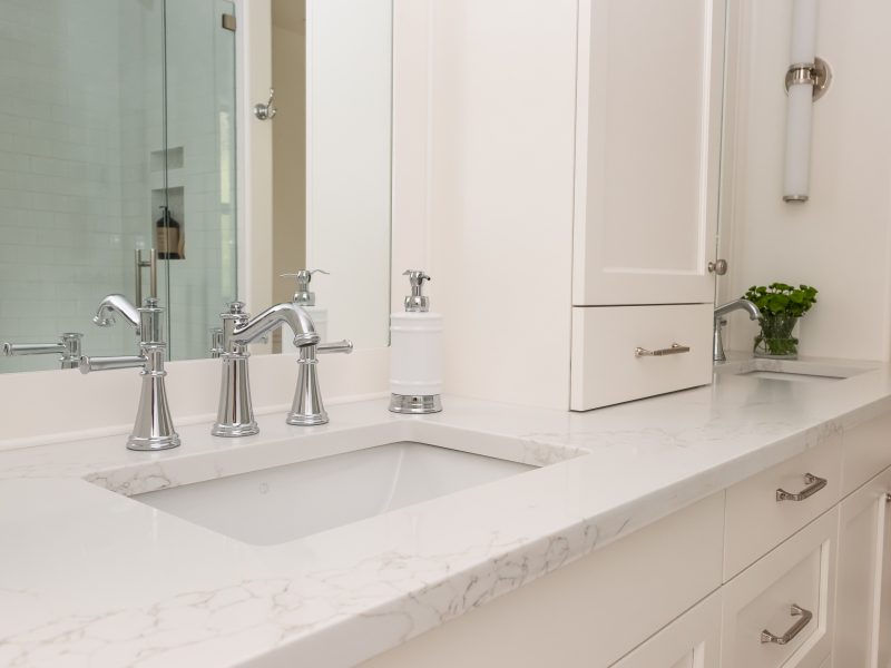 Traditional double white vanity with nickel scone and vanity tower