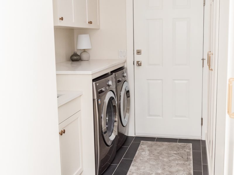 Cream mudroom Laundry room shiplap backsplash