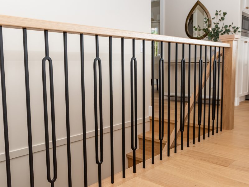White oak railing with round black spindles