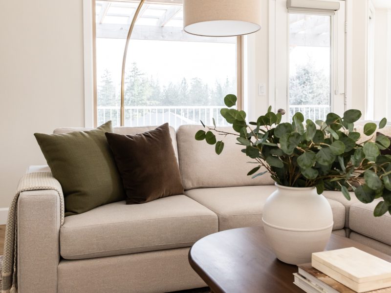 sectional with pillows and coffee table styling