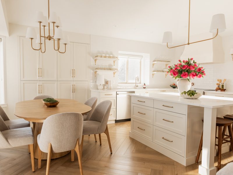 transitional cream kitchen, plaster hood, open brass shelves, tile to ceiling