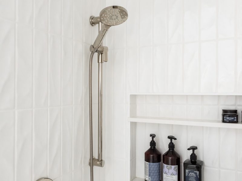 vertical textured subway tile shower, shower niche